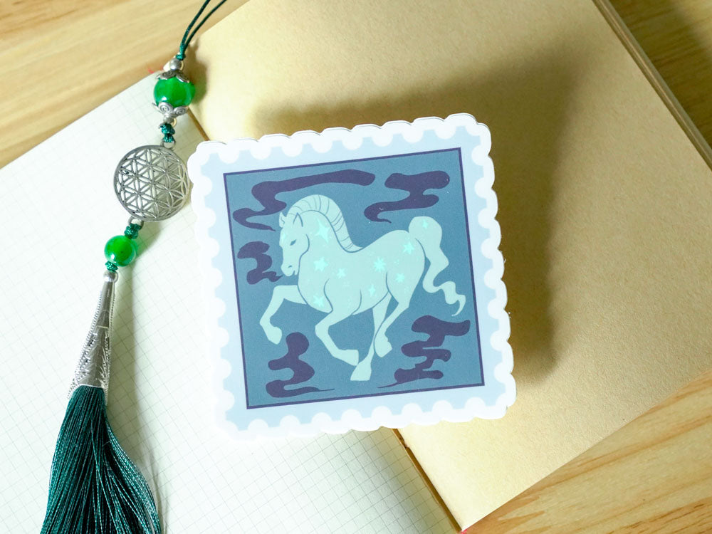 Decorative sticker with horse design on a book