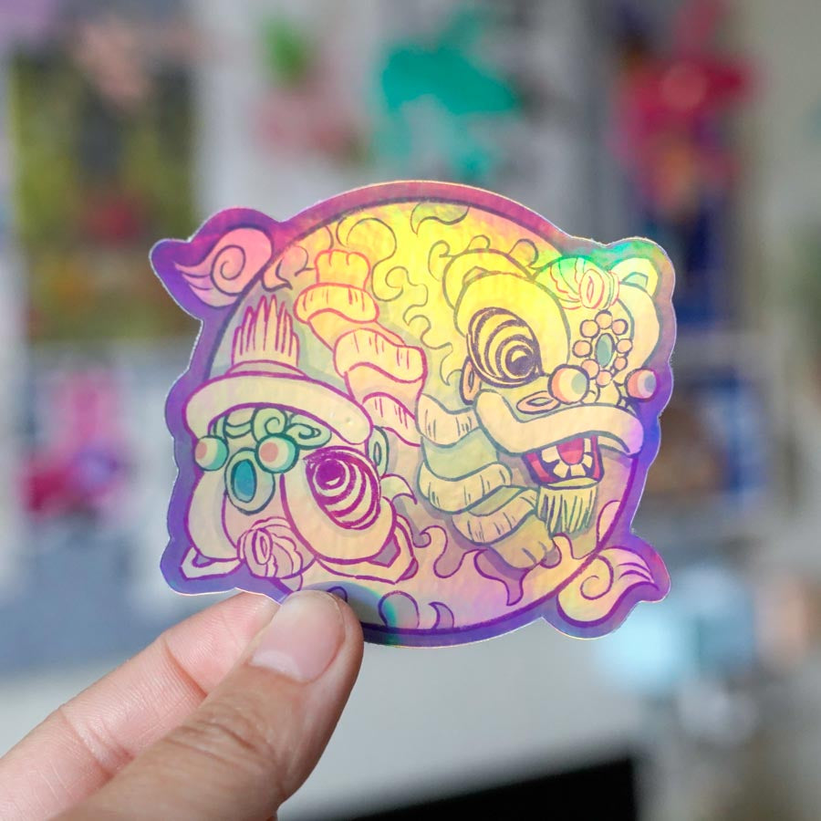 Holographic Yin Yang Fut San Hok San Lion Dance Sticker held by fingers